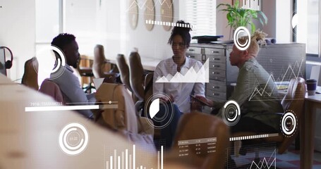 Team of three tapping tablet in business meeting and updating animated data graphics for consensus - Powered by Adobe