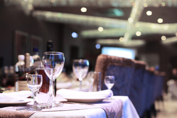 cutlery on the table in a restaurant table setting, knife, fork, spoon, interior