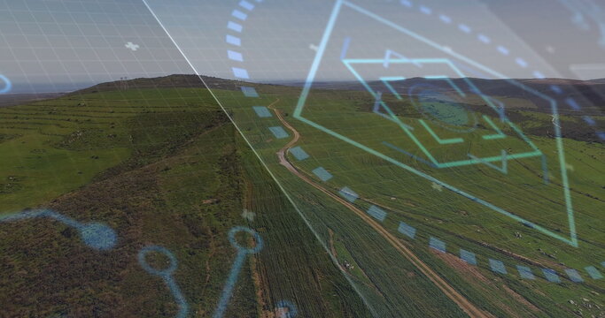 Displaying aerial view showing grassland hills over countryside, with HUD overlay and winding track