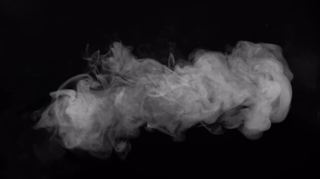 Concentrated stream of vape smoke forming a long cloud against a black background.