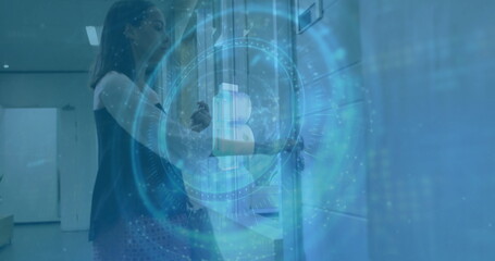 Scanning ID card, woman in black top using access reader in hallway with lockers, copy space