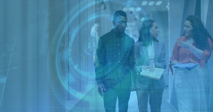 Walking team in suits holding notebook, tablet, printouts in glass corridor, with HUD overlay - Powered by Adobe