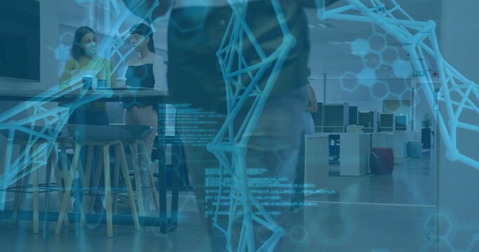 Standing two women holding coffee cups chatting at collaboration table, digital overlay, copy space