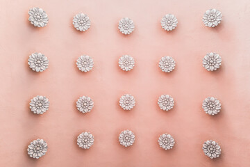 White rosettes on pink arched passage ceiling