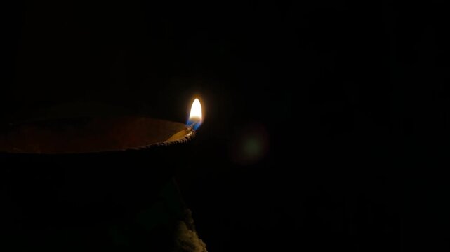 burning candle in the dark. Burning Oil Lamp Close Up | Deepak Flame in Darkness
