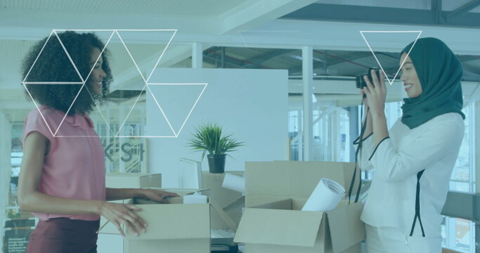 Office professionals unpacking cardboard boxes at desk, photographing items with DSLR camera - Powered by Adobe