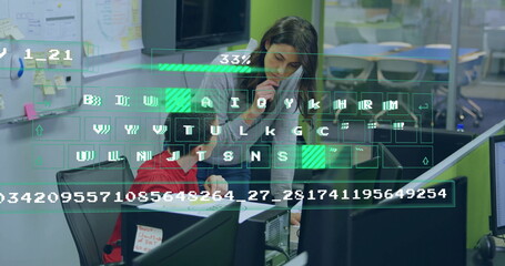 Collaborating coworkers writing printed document at office desk with phone and digital overlay