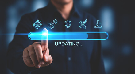 A person touching an updating progress bar with icons above on a dark background in a close up view