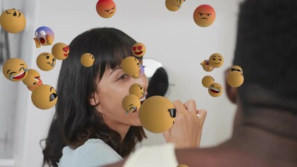 woman brushing teeth at sink starting emoji spheres swirling around couple for oral health fading