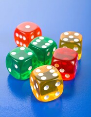Six translucent dice in red, green, and amber, rest on a blue surface