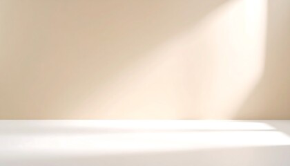 Beige studio backdrop with soft gradient lighting and white floor creating shadows and highlights