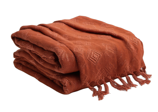 Folded terracotta throw blanket with diamond pattern and fringe