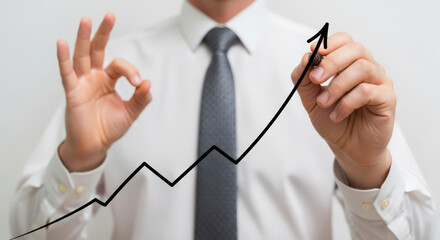 Illustrating Business Improvement A Hand Drawing an Upward Trend Line Representing Growth and Positive Performance in a Professional Setting