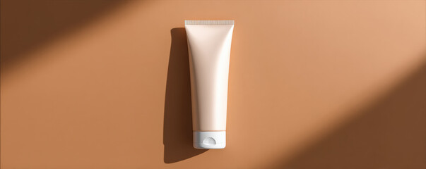 Sleek cosmetic tube rests on warm, matte surface, showcasing its minimalist design. soft lighting highlights smooth texture, creating inviting and modern aesthetic