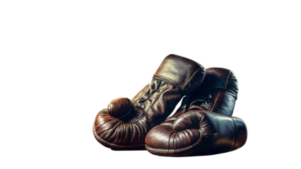 A pair of vintage brown leather boxing gloves isolated on transparent background, showcasing the sports rich history and the protective gear used in combat