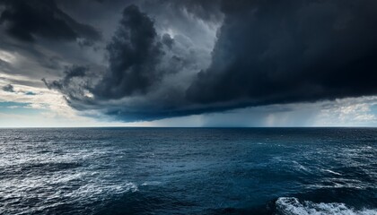 Fototapeta premium black storm clouds gathering over a vast ocean creating a powerful and dramatic scene