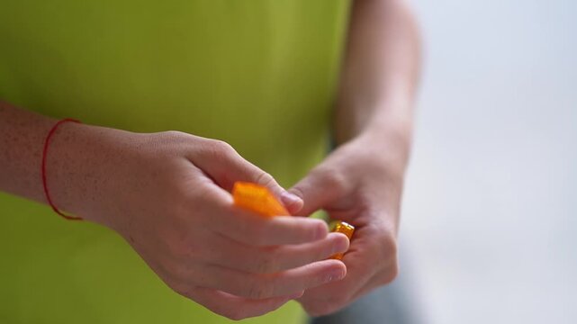 Installing a reflector on a bicycle wheel. Preparing a bicycle for the season. Updating parts, riding safety. A teenager holding reflectors for wheels
