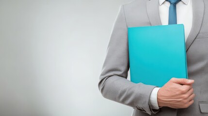 Naklejka premium Businessman Holding Blue Folder Wearing Gray Suit White Shirt.