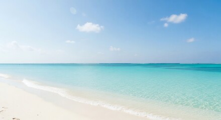 Fototapeta premium Discover the serene beauty of a pristine tropical beach, where gentle waves meet soft white sand, reflecting the clear blue sky and inviting ultimate relaxation.