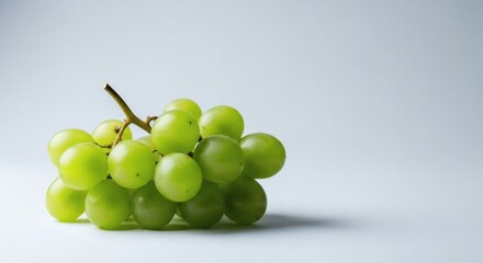 Cluster of Green Grapes on White Surface A Whisk of Freshness