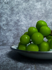 Shine muscat grapes on a white plate