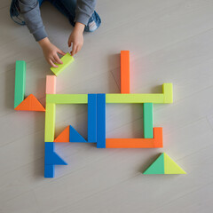 little boy playing with multi blocks
