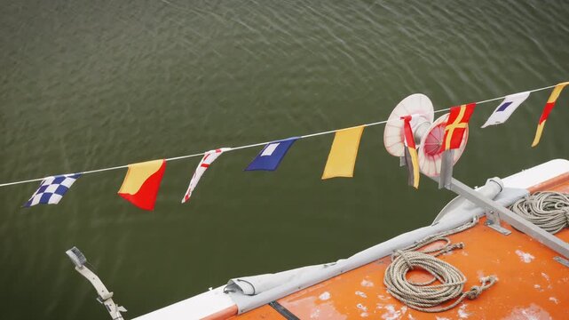 ICS flags on a boat blowing in the wind slow motion stock footage