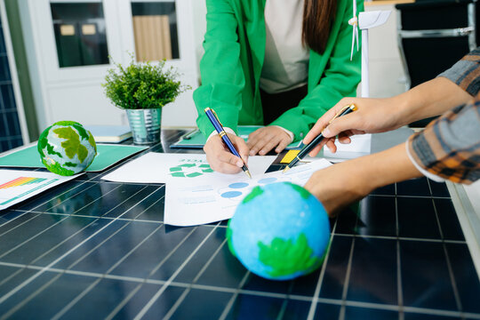business team people planning and discussing on recycle reduce reuse policy symbol in office meeting room. Green business company and Solar Energy Environment - Powered by Adobe