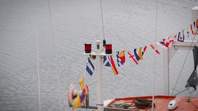 ICS flags on a boat blowing in the wind slow motion stock footage