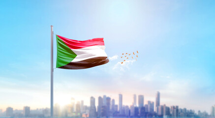Sudan national flag waving with skyline and buildings. Sudan national flag for independence day.