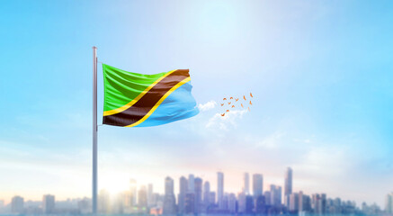 Tanzania national flag waving with skyline and buildings. Tanzania national flag for independence day.