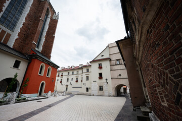 Historic street view in Krakow, Poland with architecture and visitors exploring