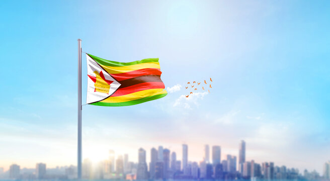 Zimbabwe national flag waving with skyline and buildings. Zimbabwe national flag for independence day.