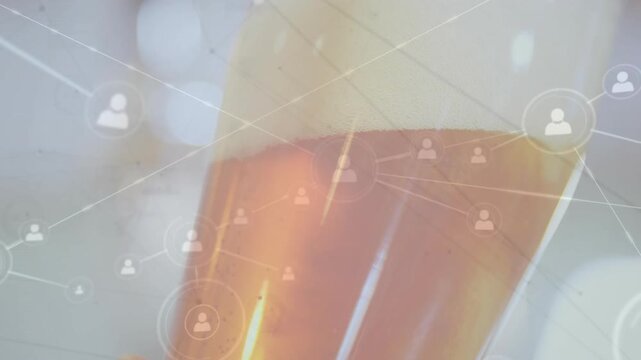 Hand entering frame lifting glass while icons multiplying and network expanding for social graph