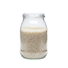 Uncooked white rice in a glass storage jar