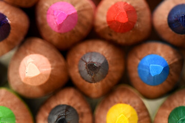 Close-up of Sharpened Colored Pencil Tips. detailed macro shot of the sharpened tips of a collection of colorful wooden pencils, packed together to create a vibrant texture and pattern. The different