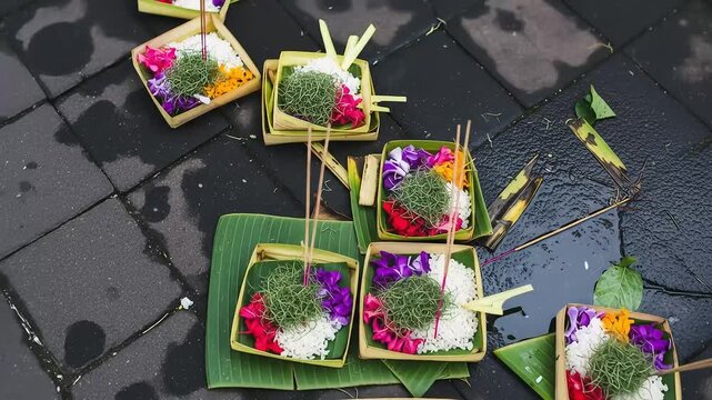 Balinese Offerings On Stone Surface Displaying Colorful Flowers Rice And Incense Sticks