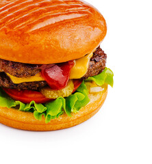Juicy hamburger with cheese and fresh ingredients served on a toasted bun