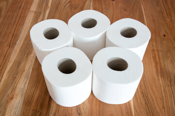 Papier rolls for toilet room on the wood background.