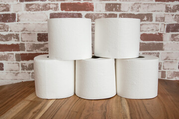 Papier rolls for toilet room on the wood background.