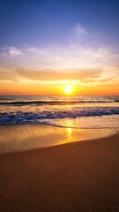 Vibrant sunset over a tranquil ocean beach, with gentle waves washing ashore
