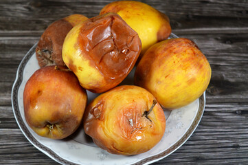 Rotten apple fruit, that harbor mold and bacteria, mould is one of the structures that certain fungi can form, formation of spores containing fungal secondary metabolites, discolored, disambiguation