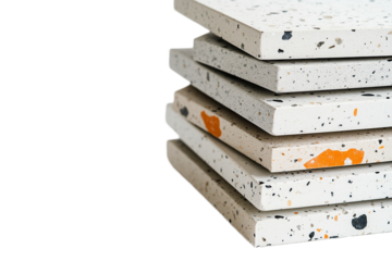 Stack of terrazzo pattern tiles with orange and black on transparent background