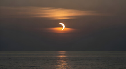 Partial Solar Eclipse at Sunset Over Calm Ocean Dramatic Celestial Event Photography