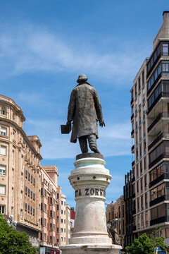Valladolid, Valladolid, Spain - May 17, 2025: Monument to Jose Zorrilla, bronze sculpture with a granite stone base dedicated to the romantic poet Jose Zorrilla in the square of his name