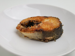 Sliced fried fish on white background