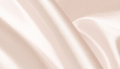 Elegant and luxurious pale pink silk fabric texture with soft waves and shiny folds. A delicate satin cloth background.
