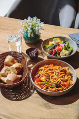 Pasta with sauce in large portions