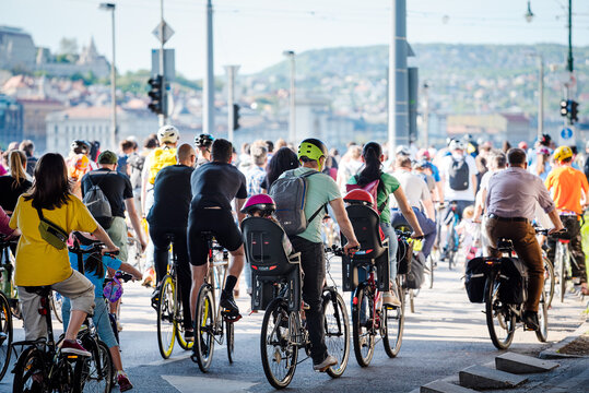 People riding bikes in city