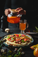 Pasta with sauce in large portions